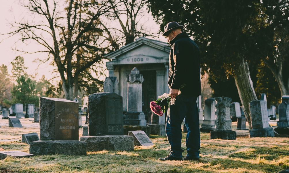 man at grave